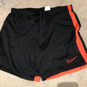 Nike black and pink basketball shorts